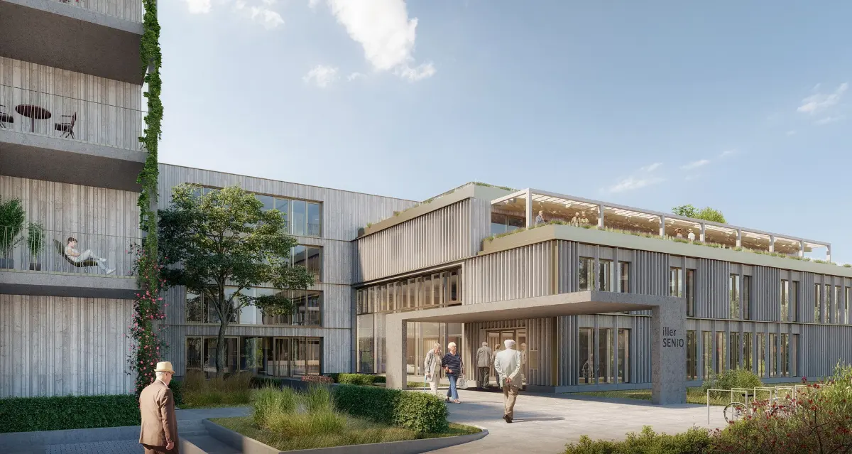 Visualisierung des Pflegeheims der Zukunft in Vöhringen mit Eingang, Holzfassade und Dachterrasse